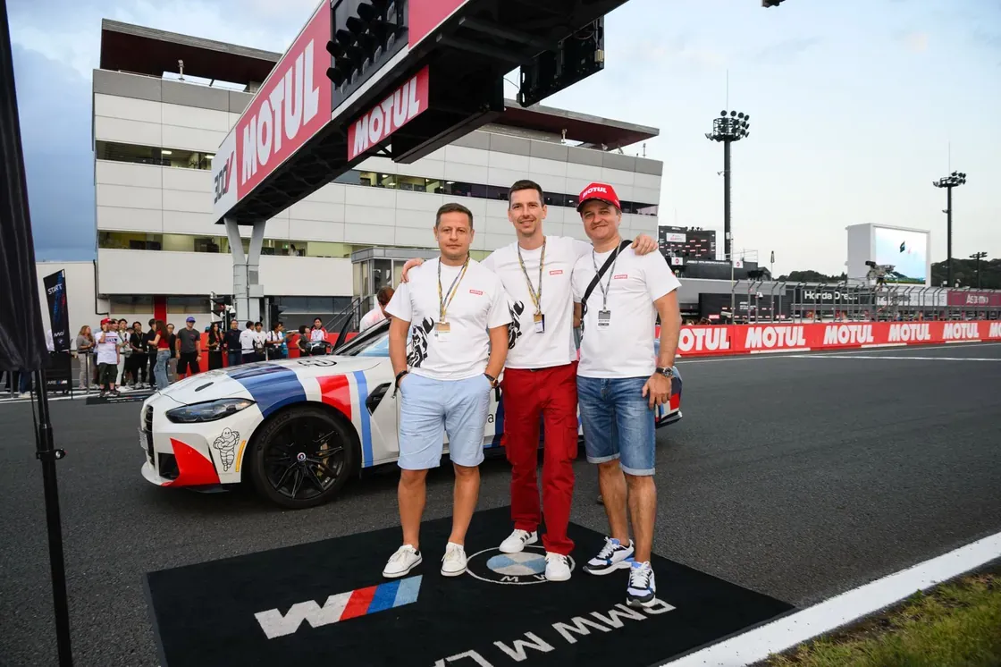 Guests on the grid beside the MotoGP safety car